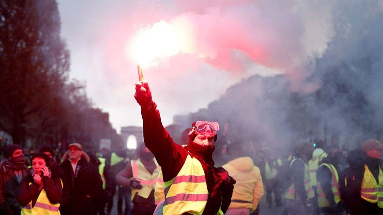 French police fired water cannons and tear gas at fuel protesters in Paris 