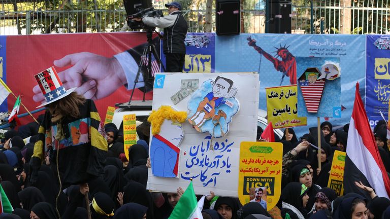Iranian protesters demonstrate outside the former US embassy in the Iranian capital Tehran