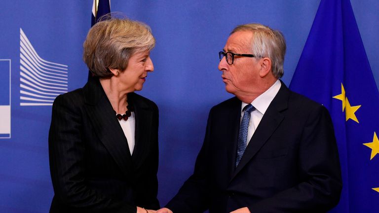 EU Commission President Jean-Claude Juncker (R) welcomes British Prime Minister Theresa May for a meeting at the EU Headquarters in Brussels on November 21, 2018. - The British Prime Minister on November 21 briefly escaped the Westminster bear pit to bring her Brexit battle to Brussels, just four days before the divorce deal is to be signed. (Photo by JOHN THYS / AFP) (Photo credit should read JOHN THYS/AFP/Getty Images)
