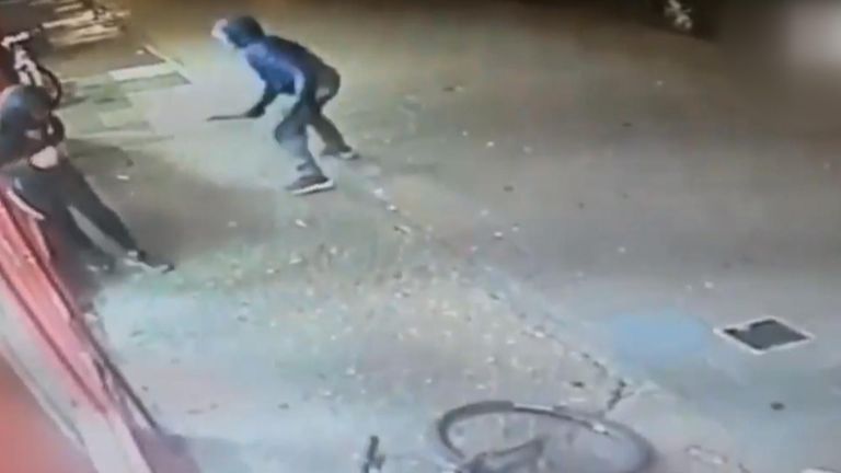 The CCTV shows an attacker approaching Jay with a knife