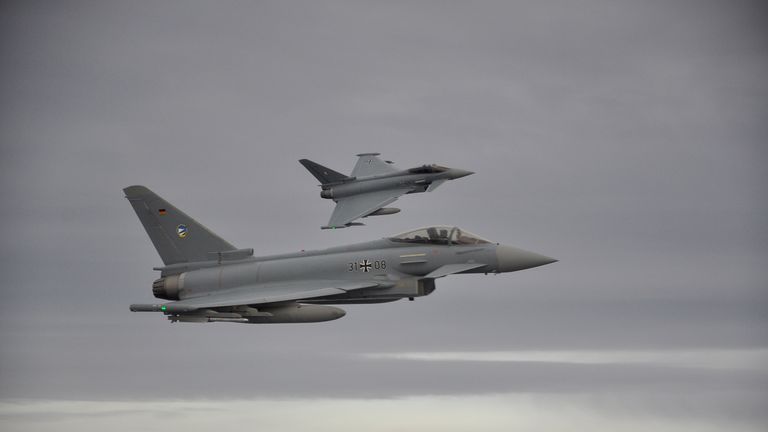 Two German Eurofighter jets simulate the interception of a plane over the Baltic sea during the drill