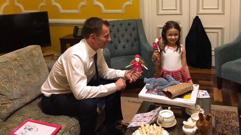 Foreign Secretary Jeremy Hunt meets Gabriella, daughter of jailed British-Iranian Nazanin Zaghari-Ratcliffe. He brought gifts for both of them. Nazanin made dolls for Gabriella and Hunt&#39;s own daughter. 

CREDIT - Pic: @FreeNazanin