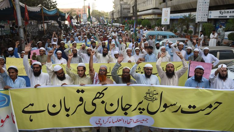 Pakistani activists of the Islamic Jamiat-e-Ittihad ul Ulema party chant slogans during a protest