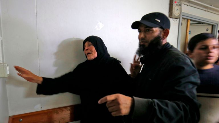 The mother of Nour Baraka, a commander for Hamas&#39; armed wing, the Ezzedine al-Qassam Brigades who was killed during an Israeli operation on Khan Younis in the southern Gaza Strip, reacts at a hospital morgue where his body was transported, on November 11, 2018. - Israel&#39;s army said an exchange of fire erupted during an operation in the Gaza Strip, while Palestinian officials reported six people killed, including a local commander of Hamas&#39; armed wing. (Photo by Said KHATIB / AFP) (Photo credit s
