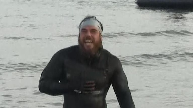 Ross Edgley emerges from the water at the end of his marathon swim