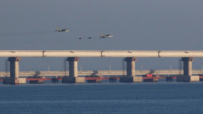 Russian jet fighters fly over a bridge connecting Russia with the Crimean peninsula