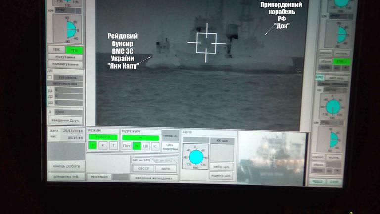 A Russian border guard vessel apparently tries to stop a Ukrainian navy tug boat. Pic: Ukrainian navy handout 