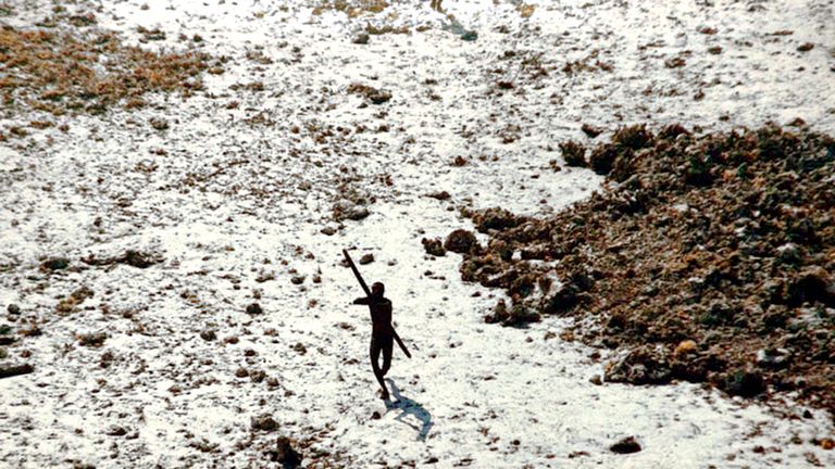 In the wake of the 2004 tsunami this member of the Sentinelese tribe was photographed firing arrows at a helicopter. Pic: © Indian Coastguard/Survival
