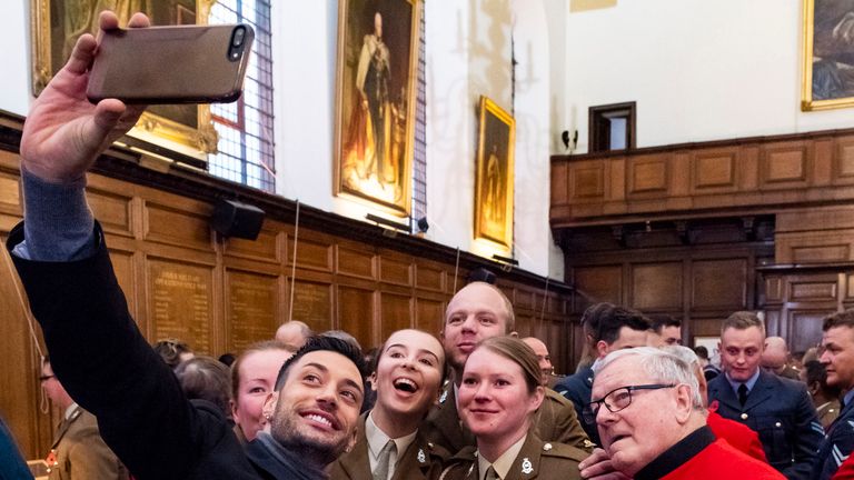 **STRICTLY EMBARGOED UNTIL 00:01 SATURDAY 10 NOV 2018**
Giovanni Pernice takes a selfie with members of the British Army and a Chelsea Pensioner.