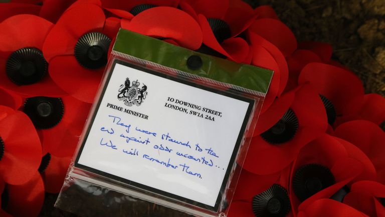 The message on a wreath that Theresa May placed at the grave of John Parr, the first British soldier to be killed in 1914, at the St Symphorien Military Cemetery in Mons