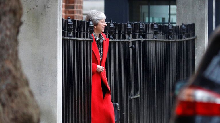 Theresa May leaves 10 Downing Street via the back exit 