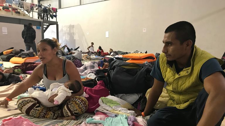 migrant camp in tiujana - Sky News pics
Juan and Orlinda Arcos and their baby Juana who is 1 month and 17 days old. The baby was born during the caravan journey. Juan and Orlinda had a direct gang threat to their lives after turning in her brother who is part of a gang