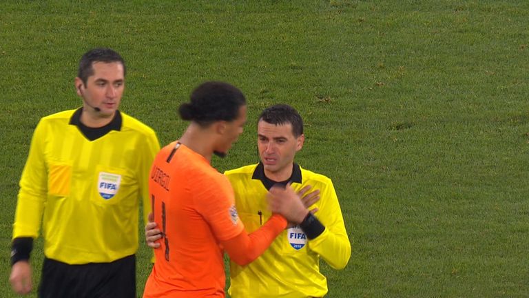 Romanian referee Ovidiu Hategan was consoled by Virgil van Dijk after the Netherlands&#39; 2-2 draw with Germany on Monday.