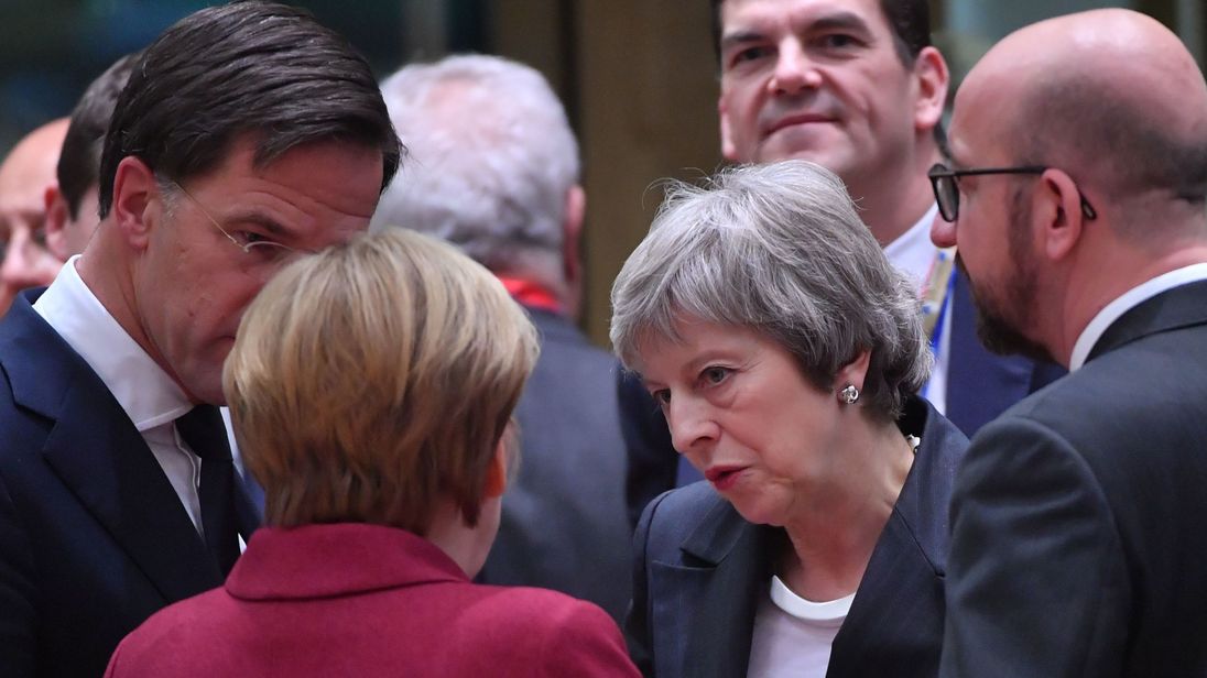 Theresa May speaking with EU leaders at the summit in Brussels