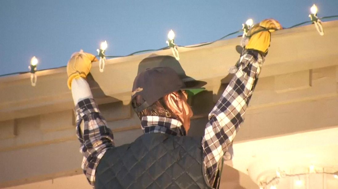 The mannequin is hanging from the roof replicating Clark Griswold in National Lampoon's Christmas Vacation