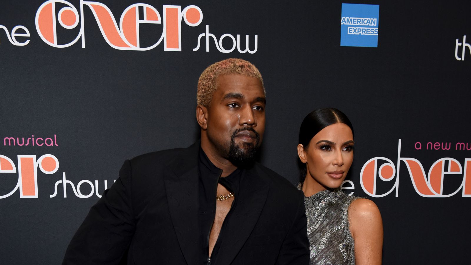 Kanye West apologises after being caught using phone during Cher
