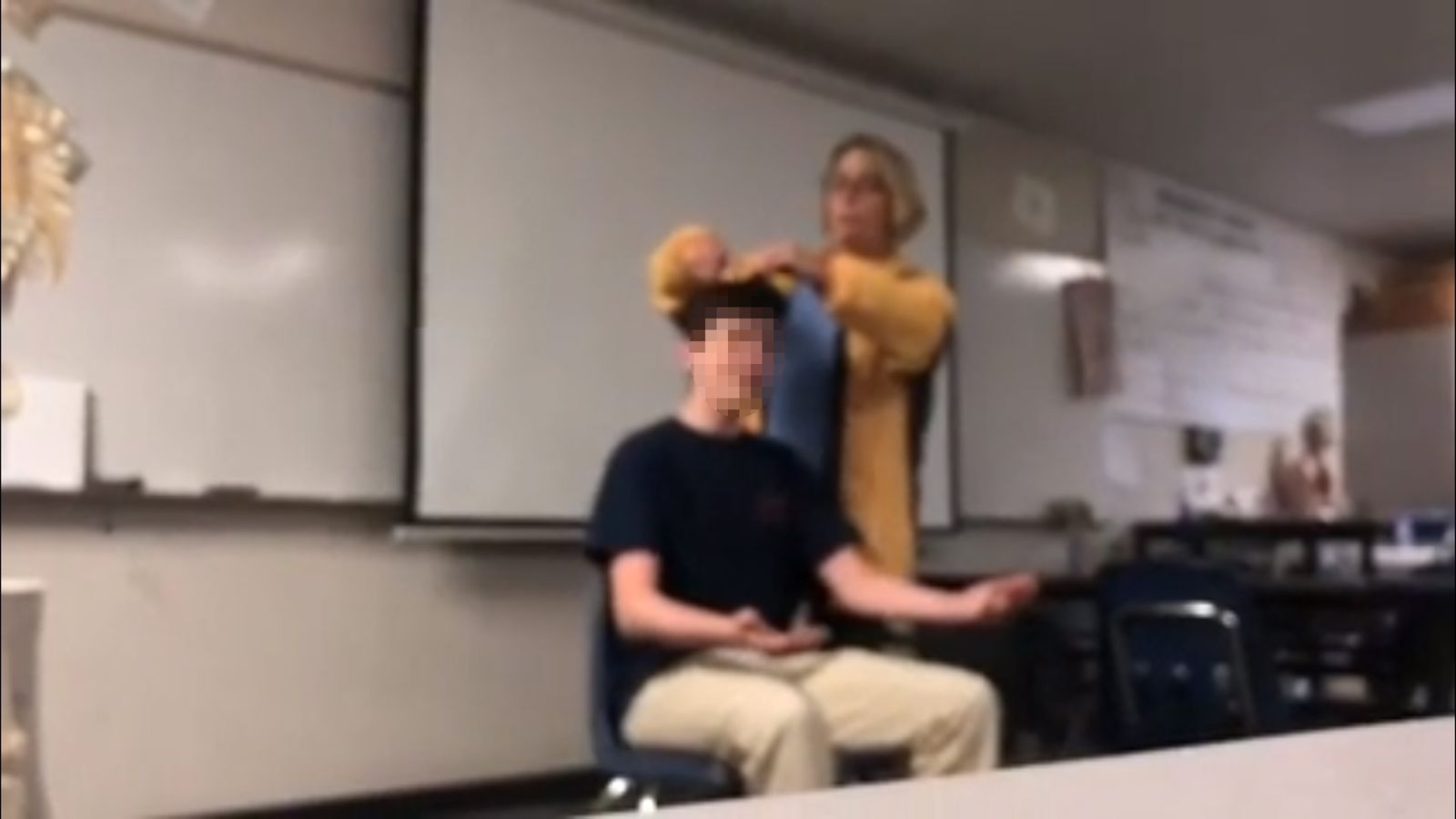 Teacher facing charges after forcibly cutting student's hair US News