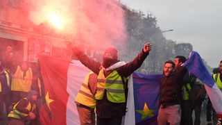 PARIS, FRANCE - DECEMBER 08: People take part in the demonstration of the yellow vests near Champs-Elysees avenue on December 08, 2018 in Paris France. 'Yellow Vests' ('Gilet Jaunes' or 'Vestes Jaunes') is a protest movement without political affiliation that protests against taxes and rising fuel prices. The 'Yellow Vest' protests have wrecked parts of Paris and other French cities for nearly a month, as the movement - inspired by opposition to a new fuel tax - has absorbed a wide range of anti