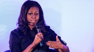 Former US First Lady Michelle Obama speaks at an event at the Elizabeth Garrett Anderson School