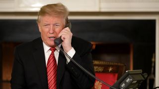 President Trump chats to children on the phone on Christmas Eve