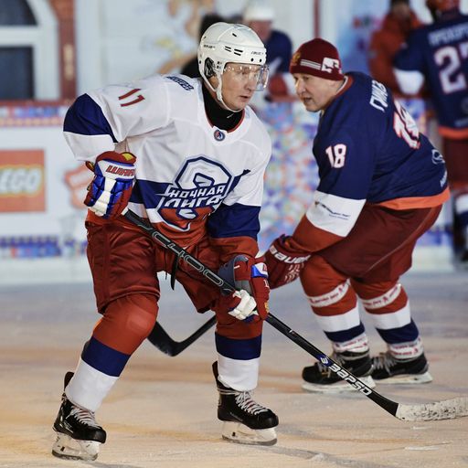 Putin plays hockey in Red Square