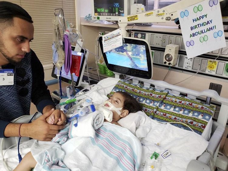 Ali Hassan with his dying son Abdullah, 2, in a hospital in Sacramento. Pic: Council on American-Islamic Relations