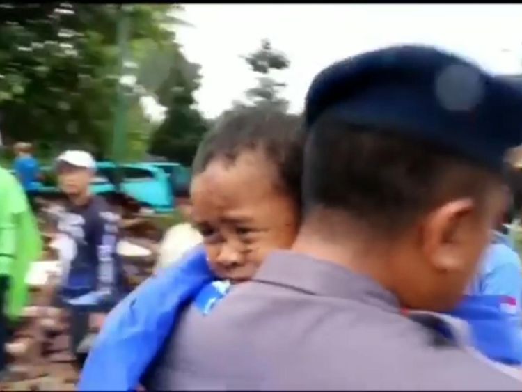 Boy rescued from rubble after tsunami in Indonesia