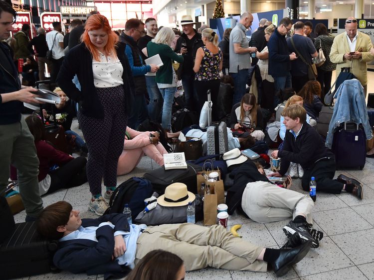 Passengers wait at the North Terminal at London Gatwick Airport