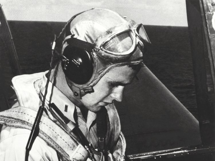 George H W Bush is pictured in the cockpit of his TBM Avenger during the World War Two