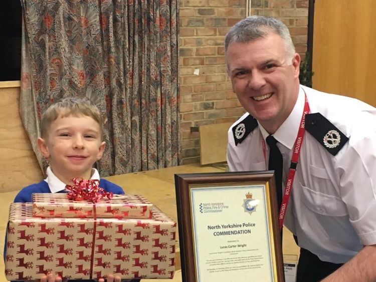 Lucas and ACC Ciaron Irvine after receiving an early Christmas present and commendation
