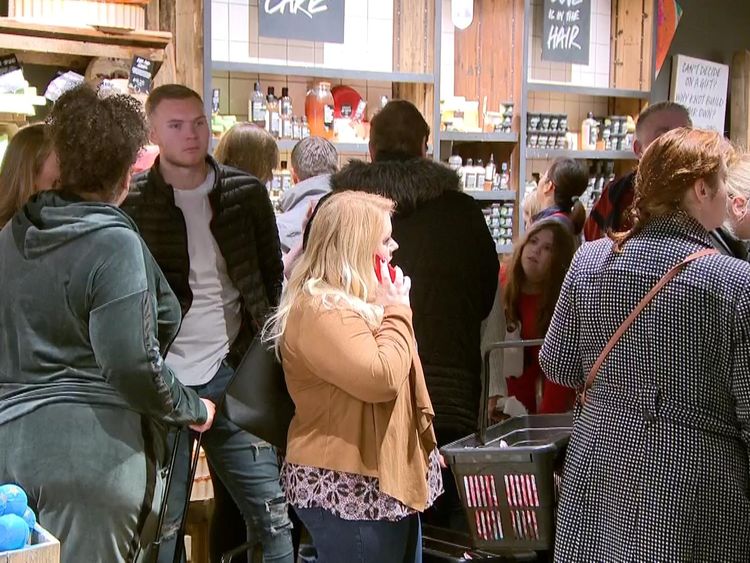 Boxing Day bargain hunters queue outside a Lush store