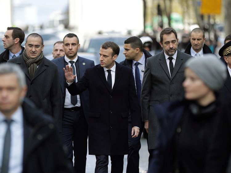 Emmanuel Macron (C) with Interior Minister Christophe Castaner (2ndR) and Paris police chief Michel Delpuech (R) arrive at the Arc de Triomphe