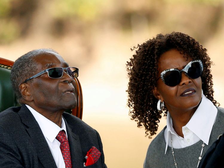 FILE PHOTO: Zimbabwe&#39;s former president Robert Mugabe and his wife Grace look on after addressing a news conference at his private residence nicknamed "Blue Roof" in Harare, Zimbabwe, July 29, 2018. REUTERS/Siphiwe Sibeko/File Photo