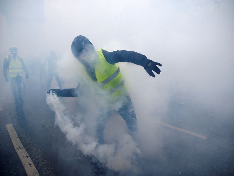Tear gas was fired at the protesters, some of whom hurled objects at police