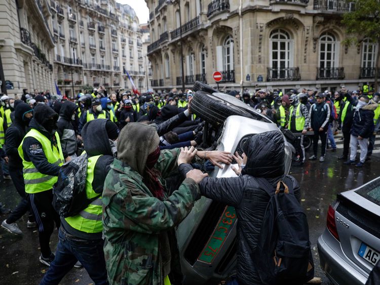 A car was overturned in the protests and some vehicles set alight