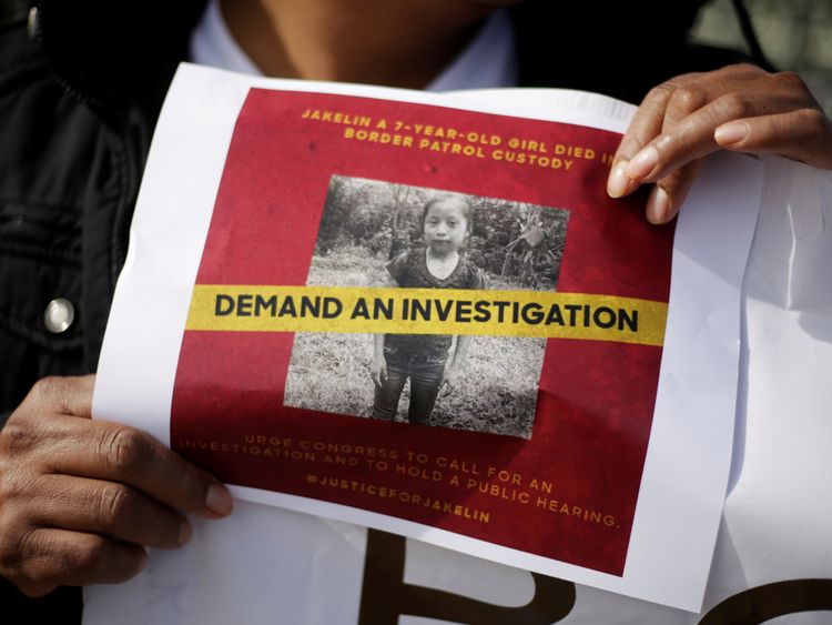 A woman holds a picture of Jakelin Caal, a 7-year-old Guatemalan girl who died in Us custody after crossing illegally from Mexico to the US