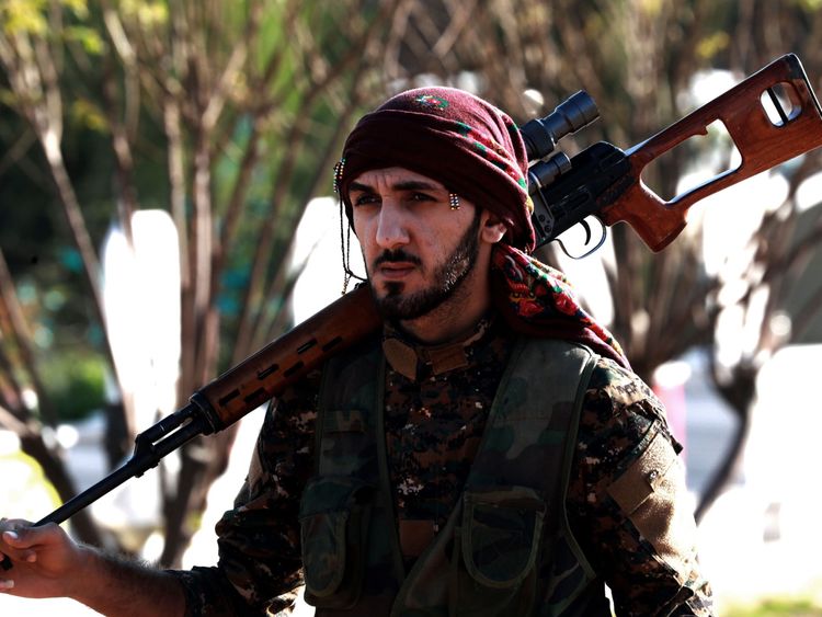 An SDF fighter at the funeral a colleague in northeastern Syria in December 2018