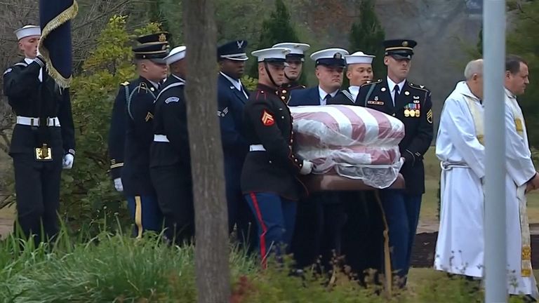 The coffin of George H.W. Bush carried by a guard of honour