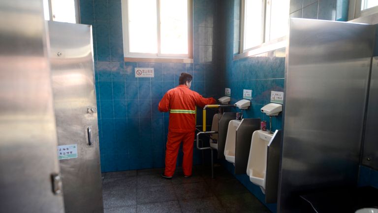 Urinals in Beijing, which are a far more modern form of toilet than parts of China are used to