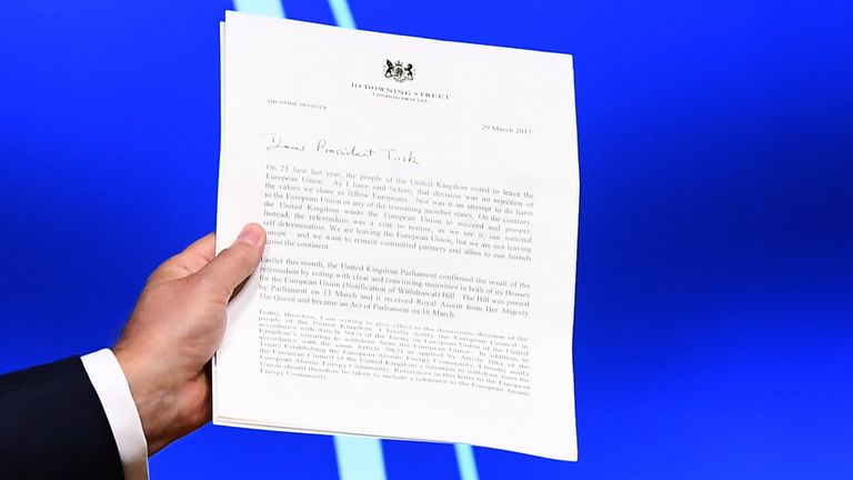 European Council President Donald Tusk holds the letter from Theresa May triggering Article 50
