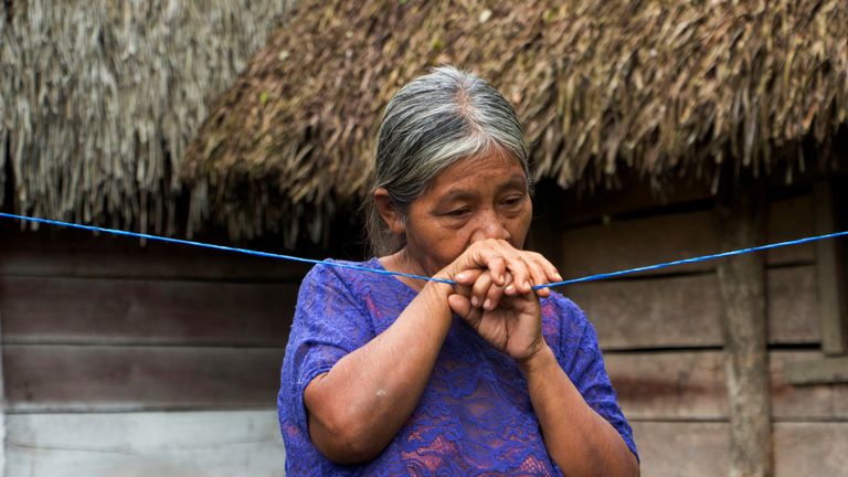 Elvira Choc, 59 grandmother of Jakelin, a 7-year-old girl who died in U.S. custody, stands outside her house in Raxruha, Guatemala December 15, 2018. REUTERS/Josue Decavele
