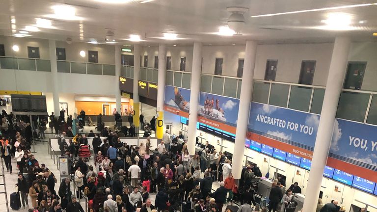 Queues of passengers in the check in area at Gatwick Airport