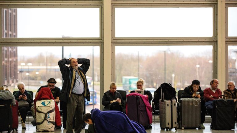 LONDON, ENGLAND - DECEMBER 21: Passengers wait in the South Terminal building at London Gatwick Airport after flights resumed today on December 21, 2018 in London, England. Authorities at Gatwick have reopened the runway after drones were spotted over the airport on the night of December 19. The shutdown sparked a succession of delays and diversions in the run up to the Christmas getaway, in what authorities have called a &#39;deliberate act&#39; to disrupt the airport. Police continue their search for 