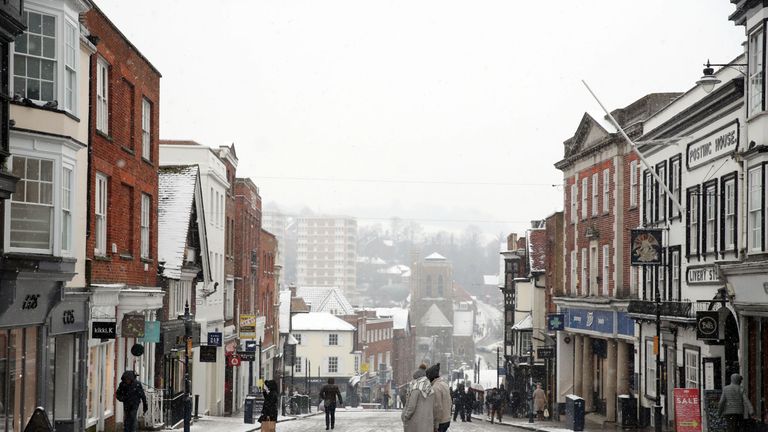 A dusting of snow covers Guildford High Street, as the severe weather conditions continue