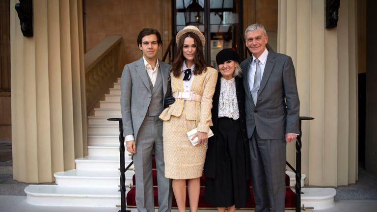 Keira Knightley with her husband, James Righton (left), and her parents, Sharman Knightley and Kevin William Knightley, as she arrives at Buckingham Palace, London to receive an OBE for her services to drama and charity at an Investiture ceremony