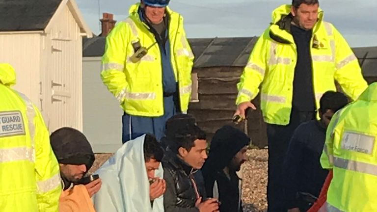 A group of suspected migrants on the beach at Kingsdown, Kent