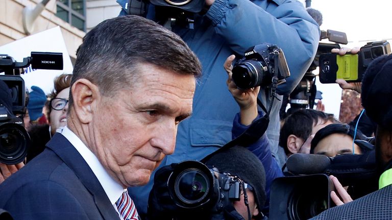 Michael Flynn leaves court after hearing his sentencing has been delayed