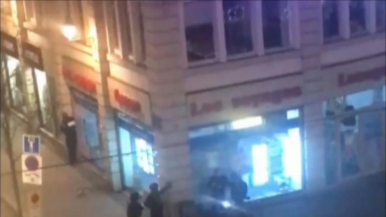 Armed police on the streets of Strasbourg shout at people to stay inside