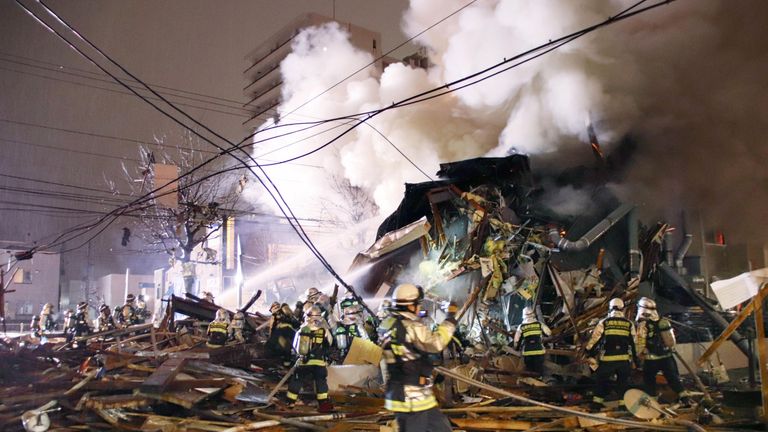 Firefighters at the scene of the explosion in Sapporo. Pic: Kyodo