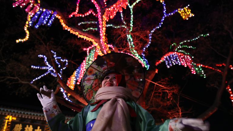 A woman celebrates the New Year at Jogyesa Buddhist temple in Seoul, South Korea